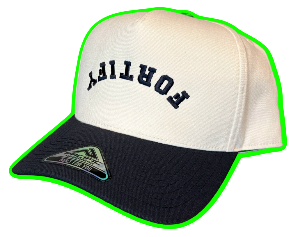 White hat with navy blue bill, navy upside down and backwards text reads "Fortify"